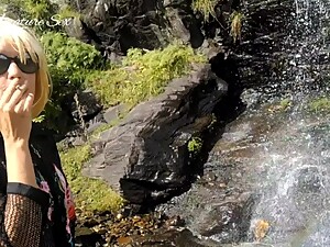 Amateur MILF smoked outdoor in a sexy outfit near waterfall